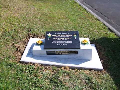 -GRANITE RECUMBENT & NAME PLATE ON CONCRETE BASE